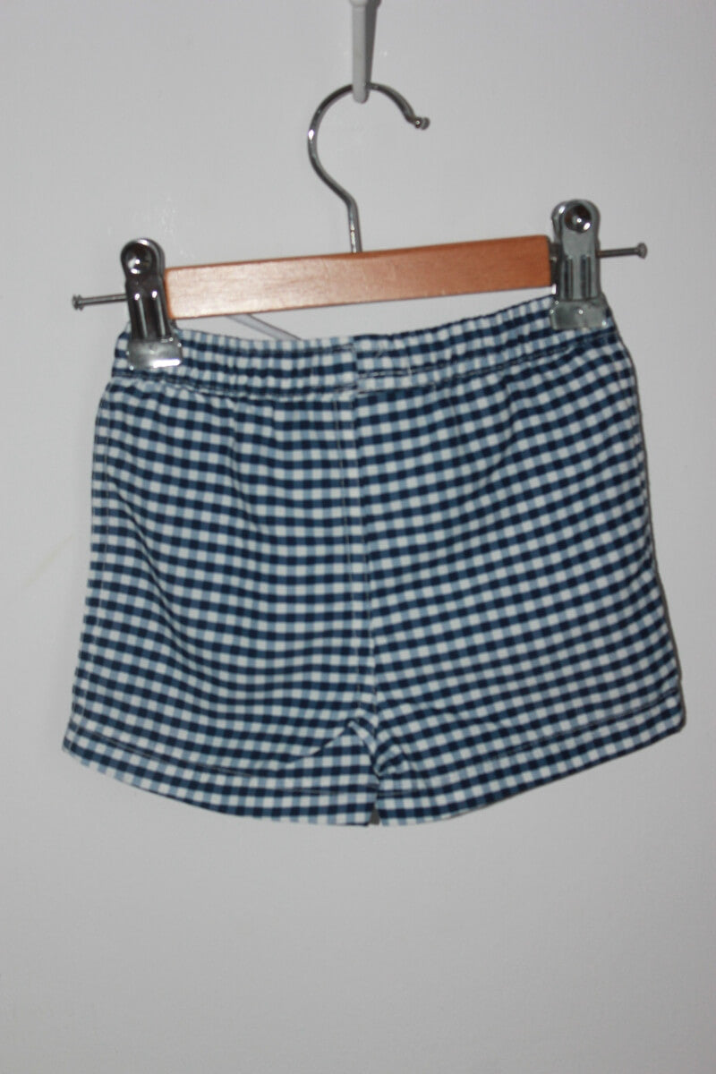 preloved donkerblauw met wit geruite zwemshort van cyrillus in maat 62-68 voor een baby jongen