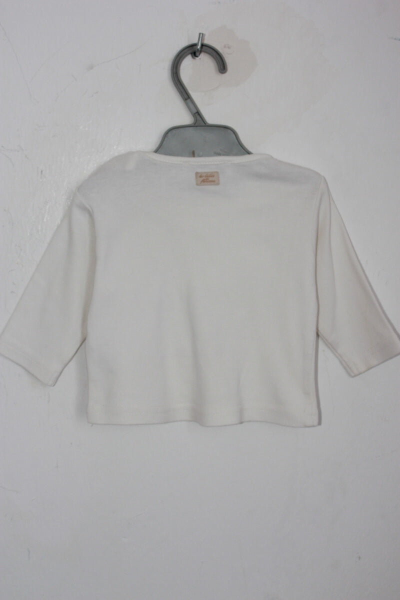 tweedehands katoenen creme longsleeve met print en volant in maat 62 voor een baby meisje van floriane