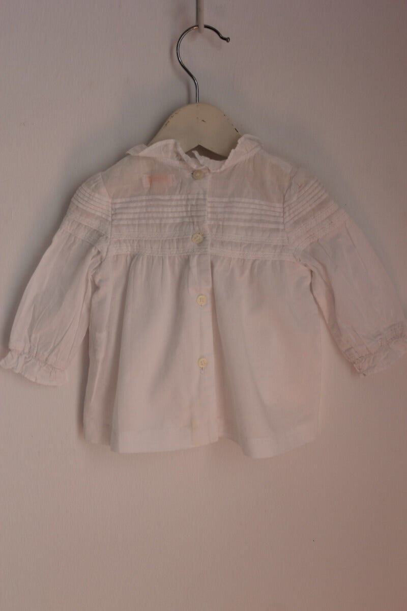tweedehands katoenen witte blouse met lange mouwen in maat 68 voor een baby meisje van gocco