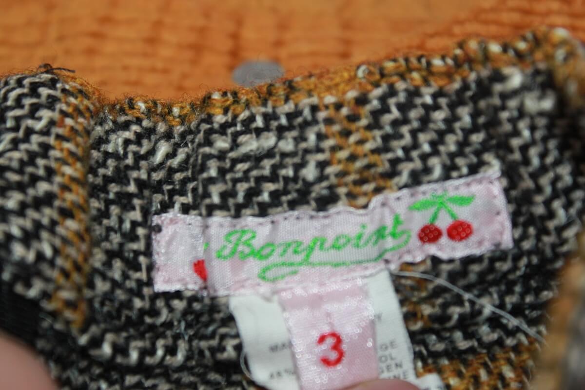 tweedehands winterse grijs met mosterdgeel geruite asymmetrische rok van bonpoint in maat 92