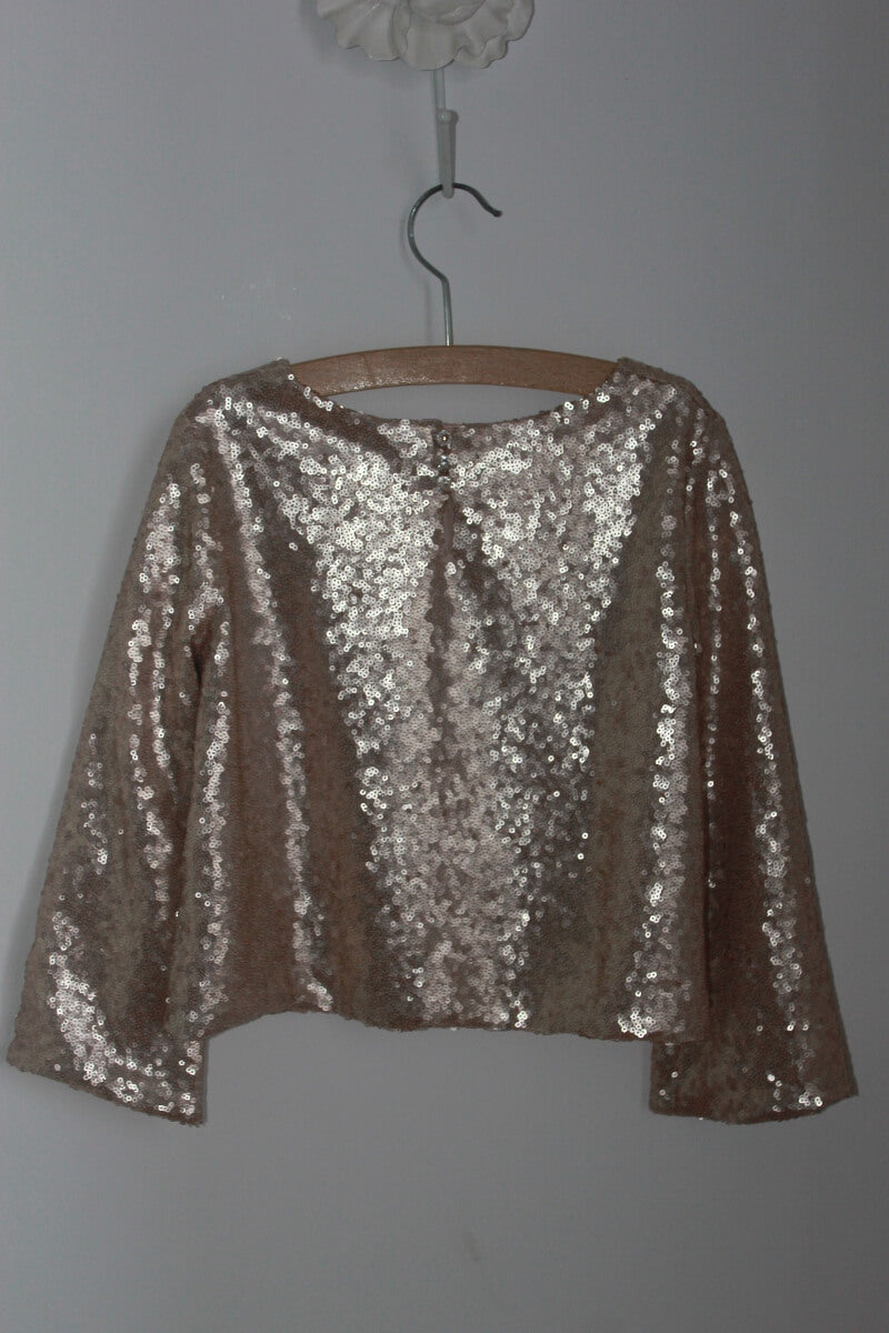 tweedehands top met gouden pailletten en lange mouwen van bonpoint in maat 110-116 voor een meisje