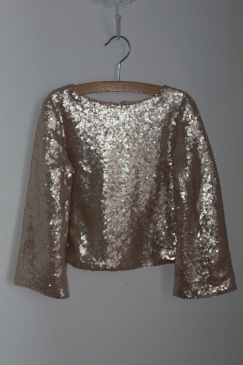 tweedehands top met gouden pailletten en lange mouwen van bonpoint in maat 110-116 voor een meisje