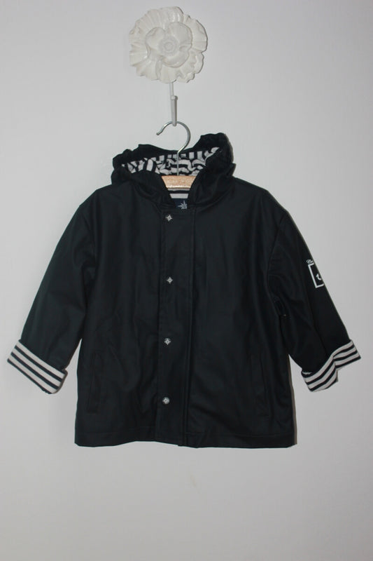 tweedehands unisex donkerblauw-witte regenjas met capuchon van crique privee in maat 98