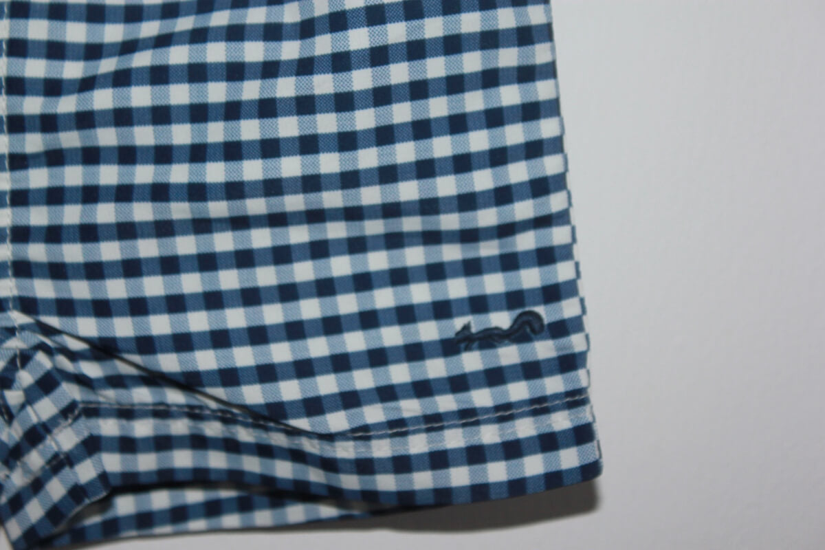 preloved donkerblauw met wit geruite zwemshort van cyrillus in maat 62-68 voor een baby jongen