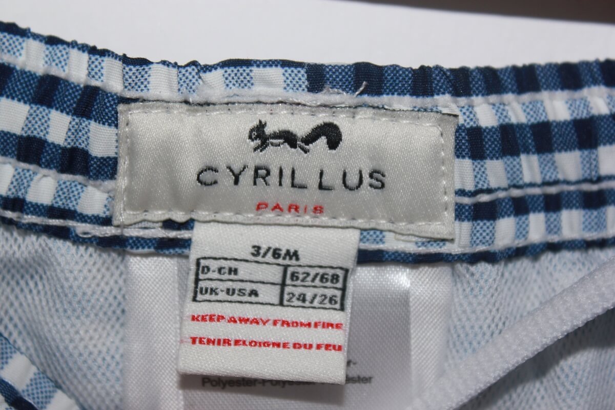 preloved donkerblauw met wit geruite zwemshort van cyrillus in maat 62-68 voor een baby jongen