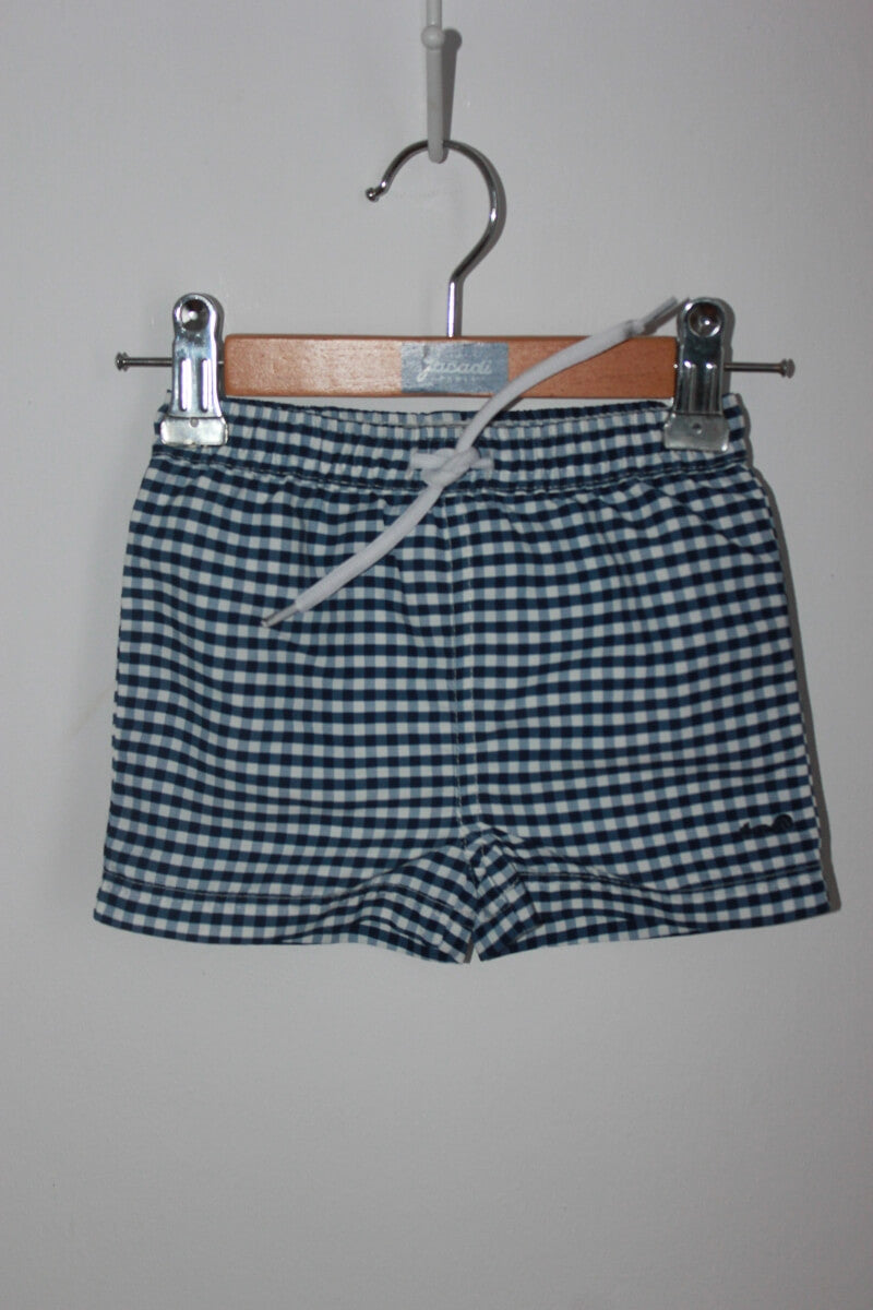 preloved donkerblauw met wit geruite zwemshort van cyrillus in maat 62-68 voor een baby jongen