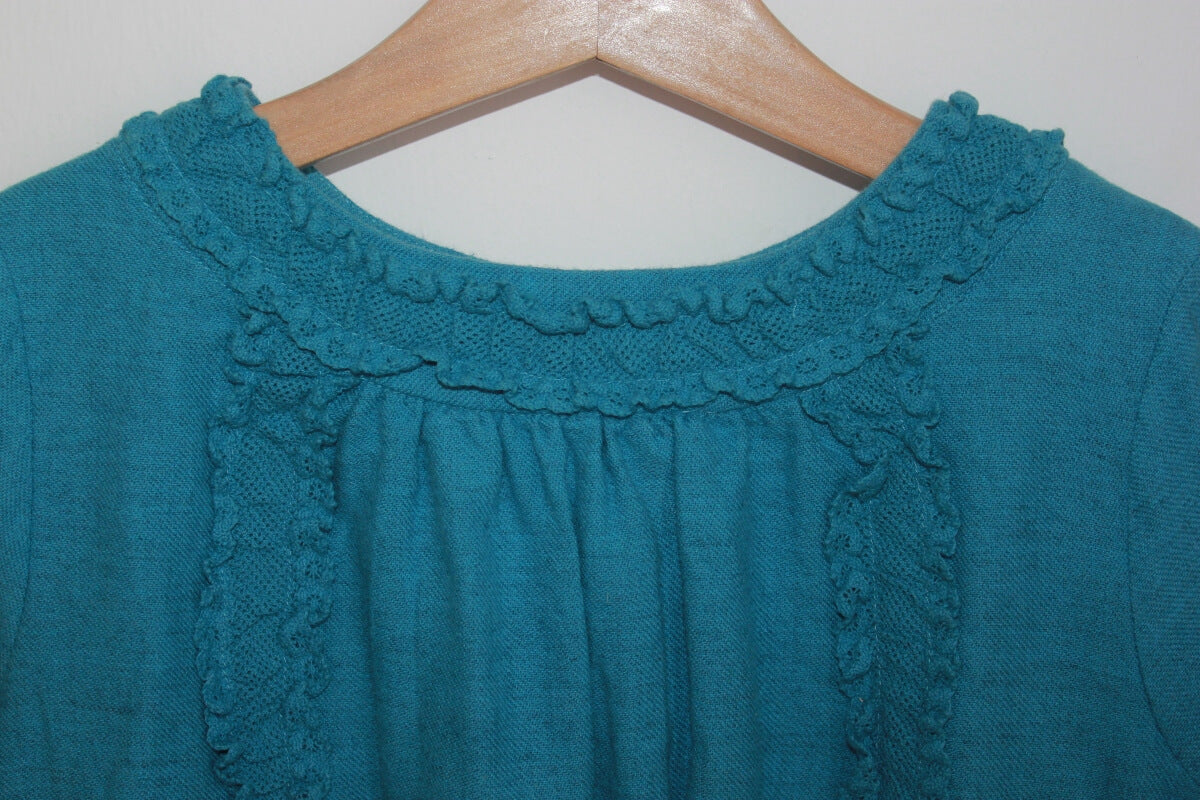 Blauwe jurk met lange mouwen van bonpoint in maat 128 voor een meisje