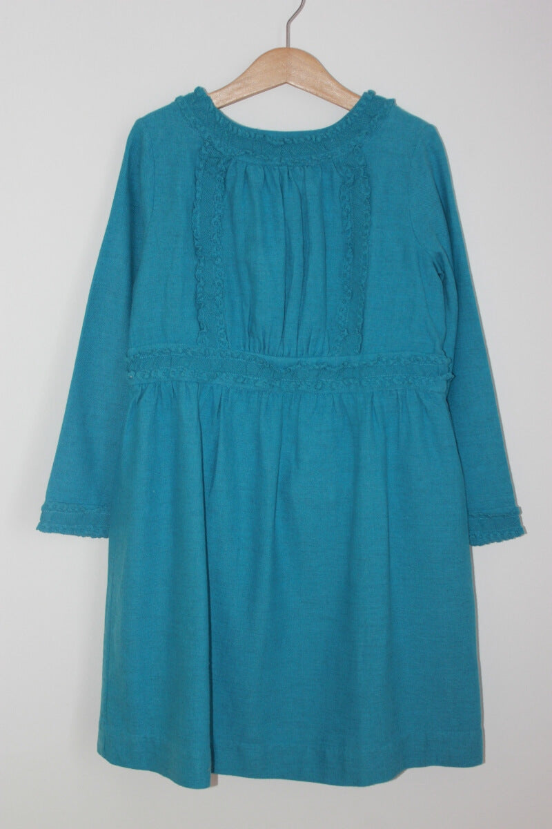 Blauwe jurk met lange mouwen van bonpoint in maat 128 voor een meisje