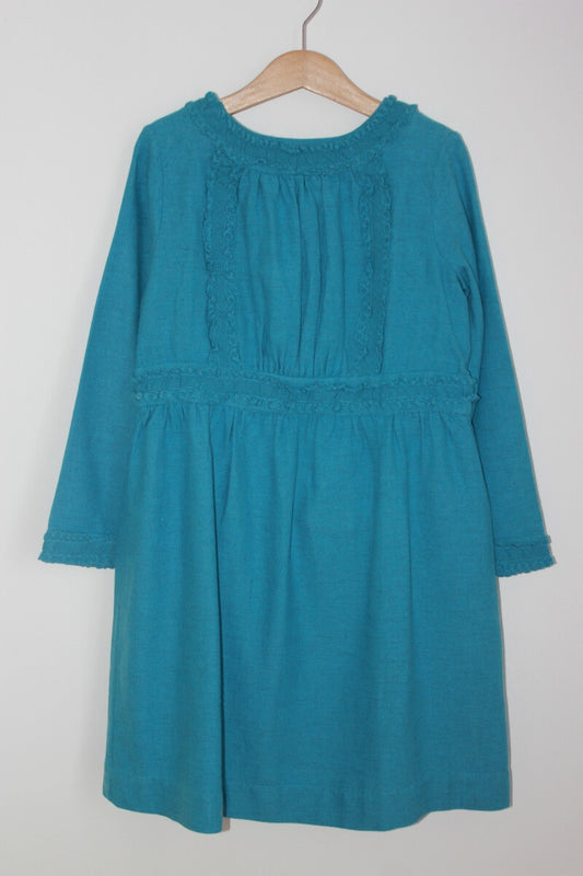 Blauwe jurk met lange mouwen van bonpoint in maat 128 voor een meisje