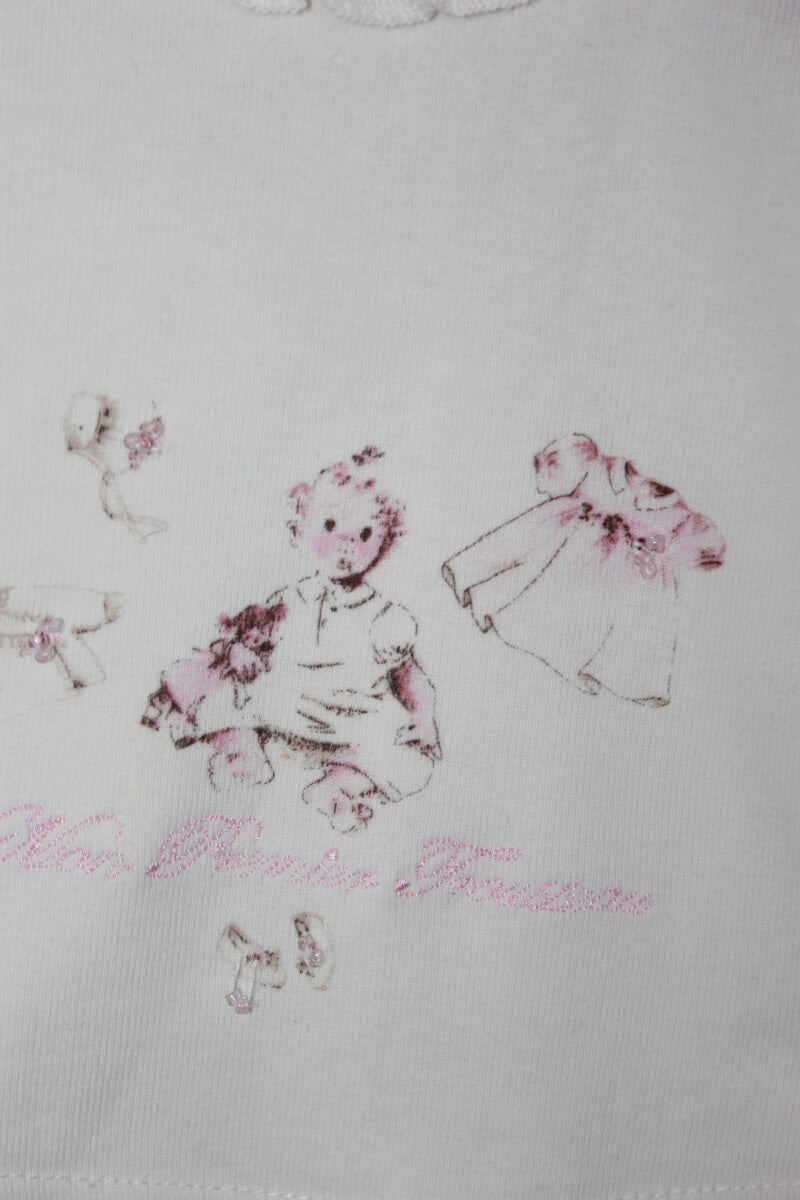 tweedehands katoenen creme longsleeve met print en volant in maat 62 voor een baby meisje van floriane