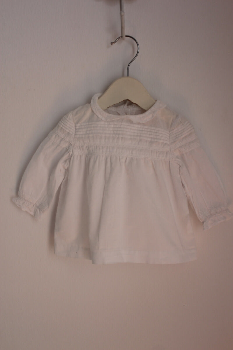 tweedehands katoenen witte blouse met lange mouwen in maat 68 voor een baby meisje van gocco