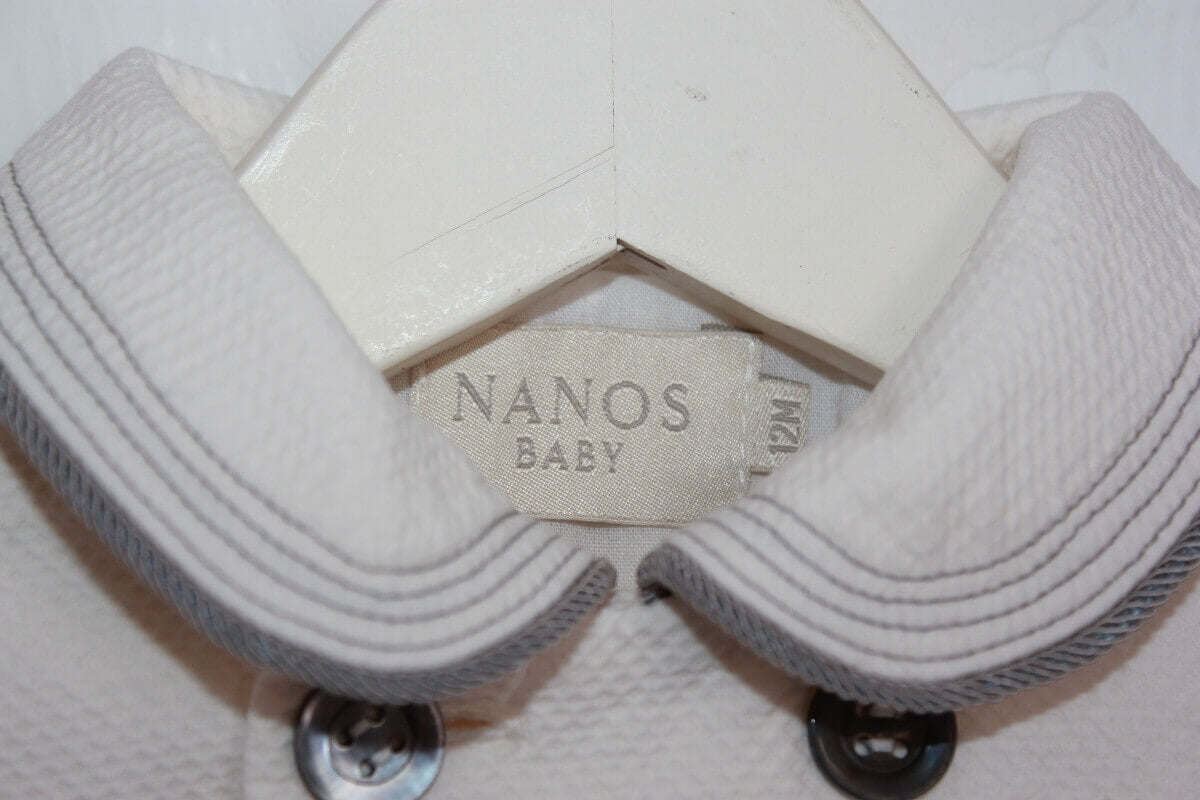 tweedehands unisex katoenen zomerse ecru  jas met grijze details van Nanos in maat 68