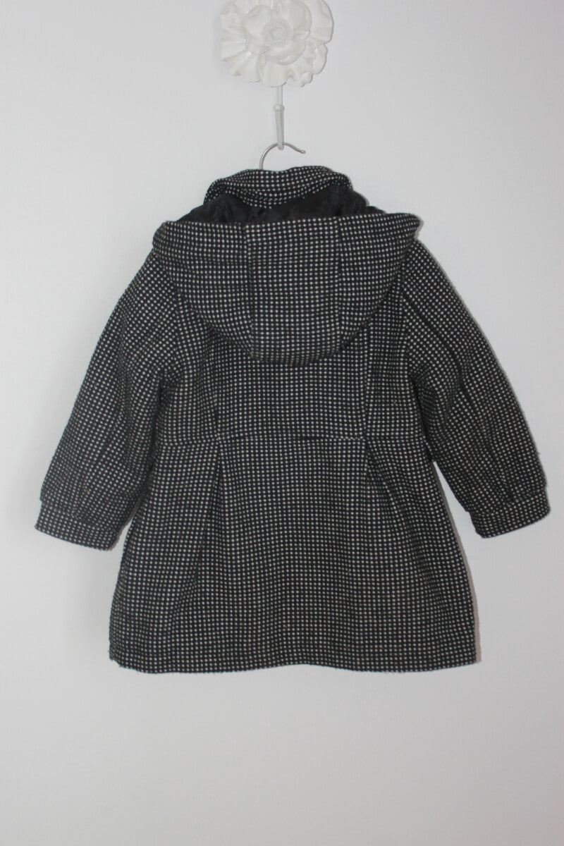 tweedehands zwarte jas met ecru stipjes en capuchon in maat 98 voor een meisje van palomino