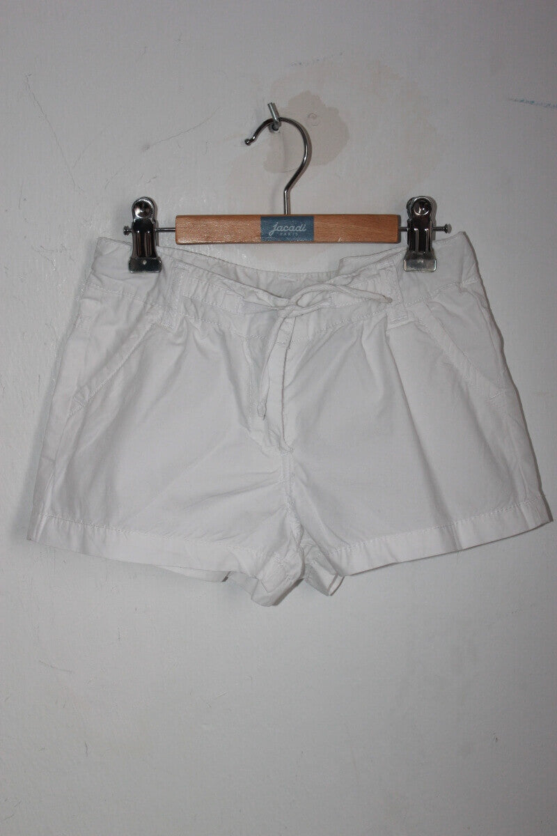 tweedehands katoenen witte korte broek in maat 128 voor een meisje van tao