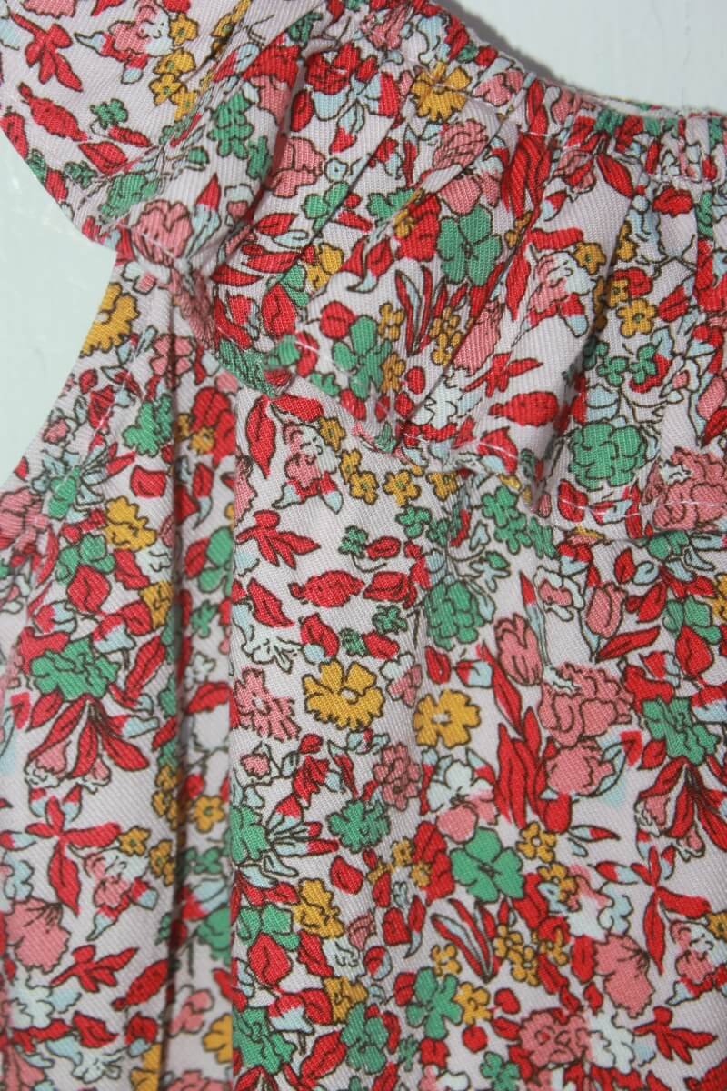 tweedehands gebloemde zomerse jumpsuit in multicolour met volant, maat 110 van vert baudet