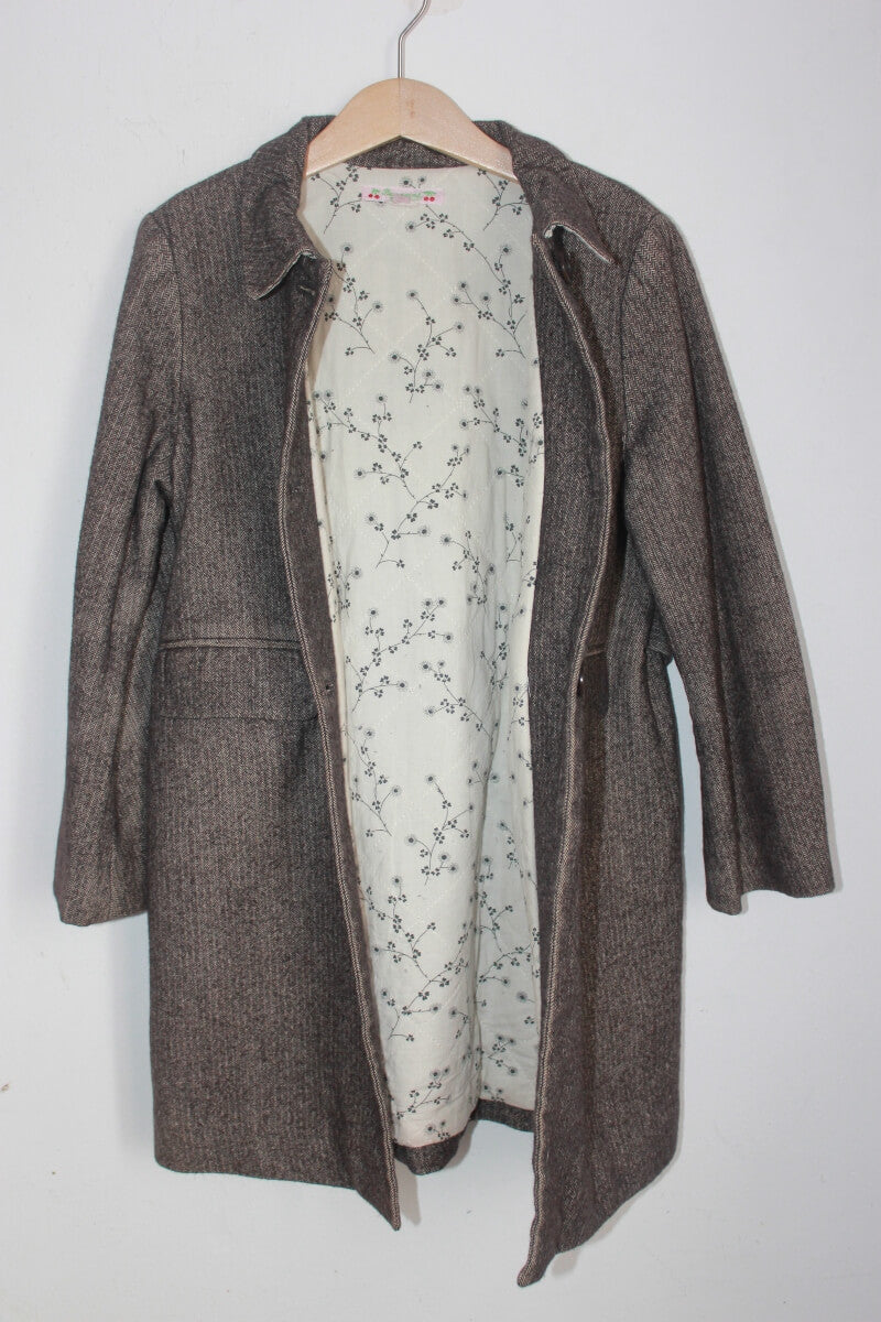 tweedehands bruingrijs en ecru gemeleerde jas van bonpoint in maat 122-128 voor een meisje