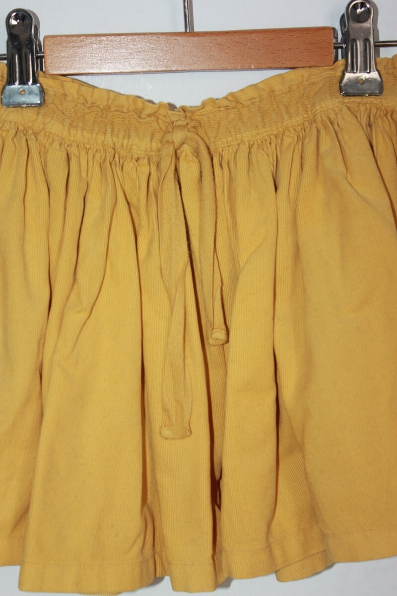 tweedehands ribfluwelen mosterdgele rok van bonton in maat 110-116